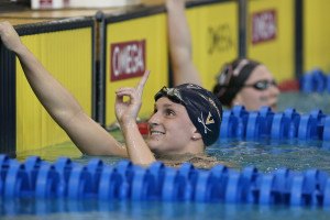 Leah Smith throwing up the number one after winning the 1650 free. Photo Credits: Tim Binning/TheSwimPictures.com