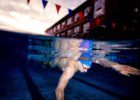 Olympic Champion Swimmer Caeleb Dressel underwater by Mike Lewis