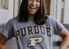 Female diver smiles while wearing a Purdue shirt