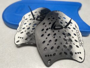 The Right Way to Use Swim Paddles for a Stronger Stroke (and More Speed)